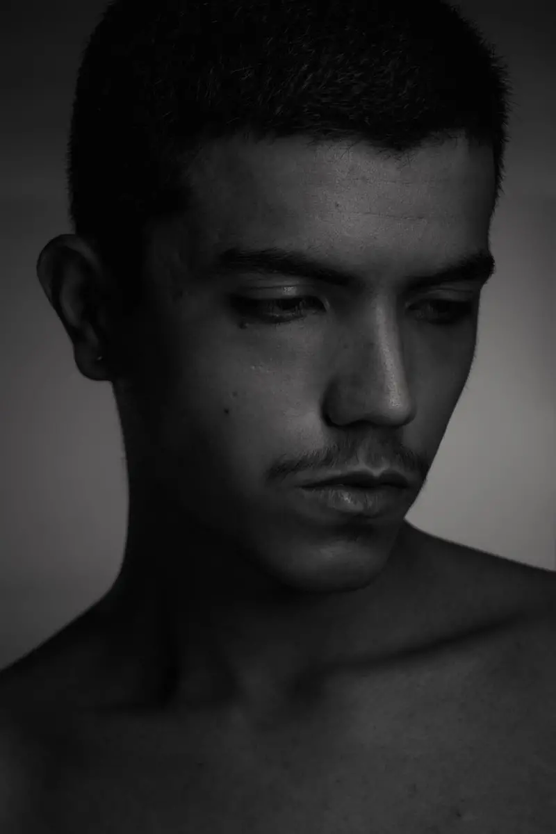 grayscale photo of mans face